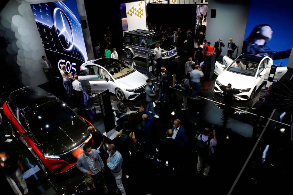 Visitors stand at Mercedes booth ahead of the Munich Motor Show IAA Mobility 2021 in Munich, Germany on Sept. 6, 2021. (Michaela Rehle/Reuters)