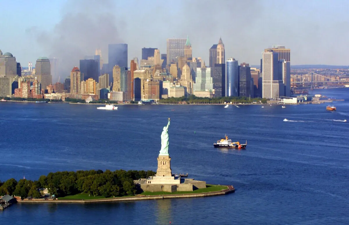 Smoke continues to rise from the destroyed World Trade Center on Sept. 15, 2001. (KEITH MEYERS/AFP via Getty Images)