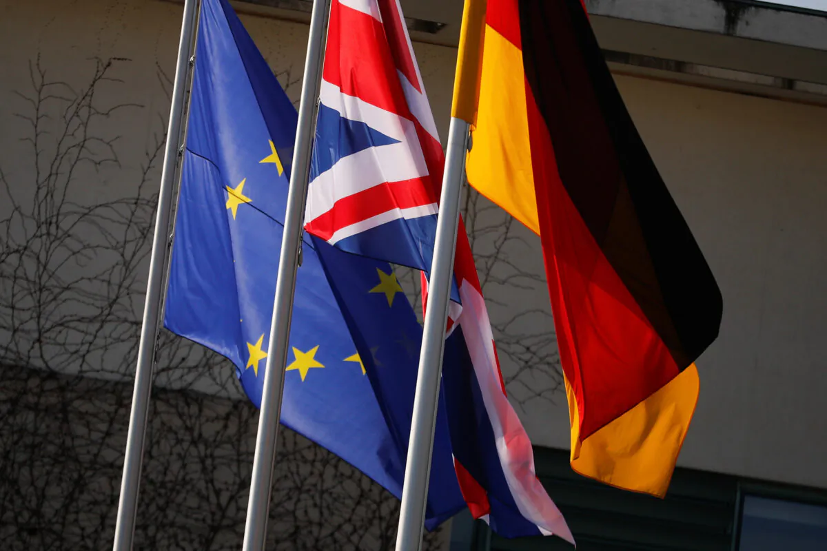 European Union, British, and German flags flutter in front of a chancellery in Berlin, Germany, on April 9, 2019. (Hannibal Hanschke/Reuters)