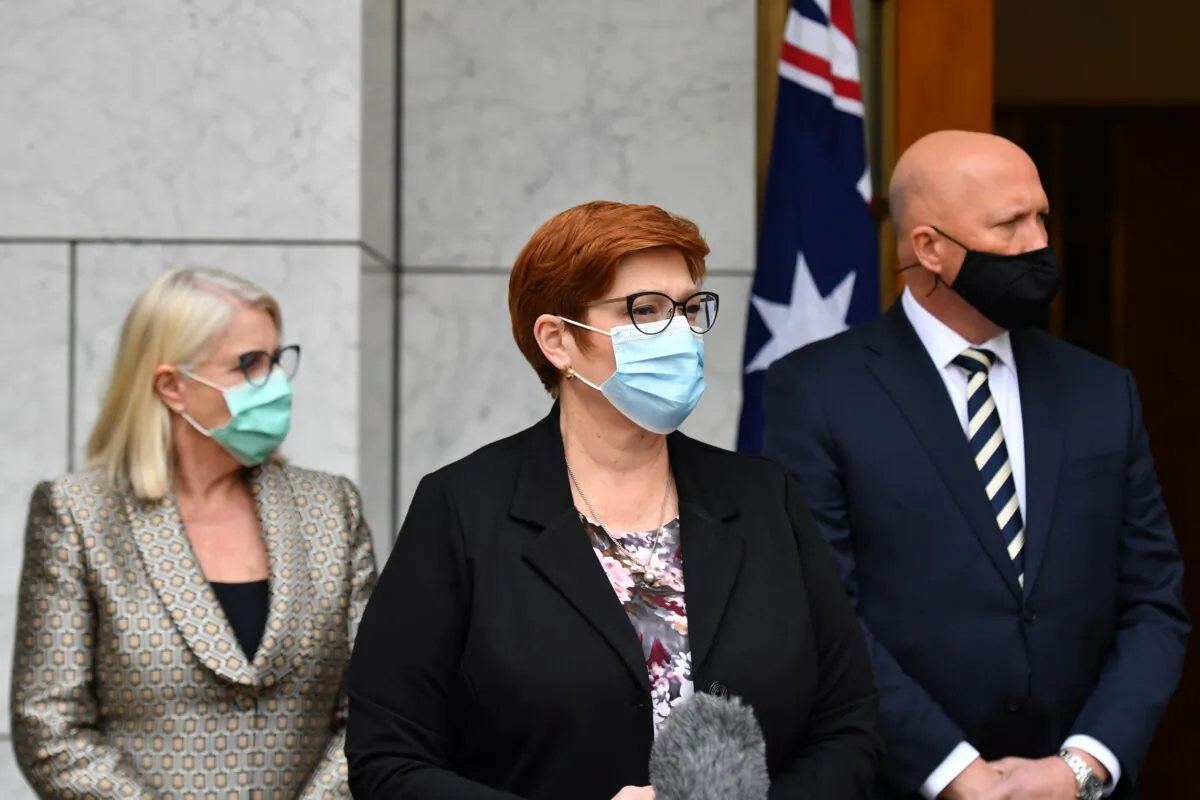 Minister for Foreign Affairs Marise Payne (C) and Minister for Defence Peter Dutton (R) at a press conference at Parliament House in Canberra, Australia, Aug. 27, 2021. (AAP Image/Mick Tsikas)