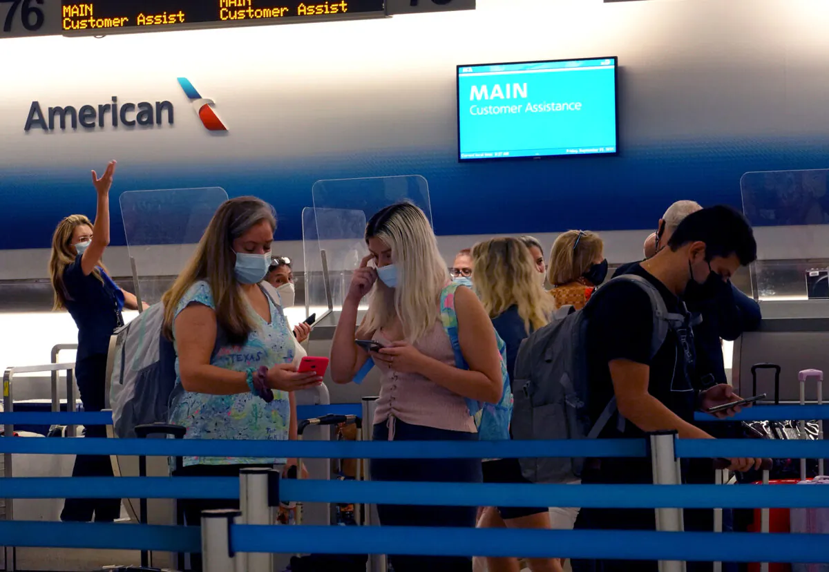 Travelers wait to drop their baggage at the American Airlines counter in the Miami International Airport in Miami, Fla., on Sept. 3, 2021. (Joe Raedle/Getty Images)