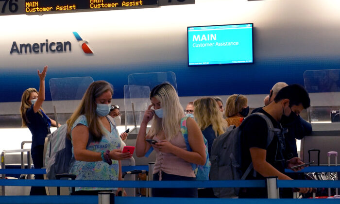 Travelers wait to drop their baggage at the American Airlines counter in the Miami International Airport in Miami, Fla., on Sept. 3, 2021. (Joe Raedle/Getty Images)