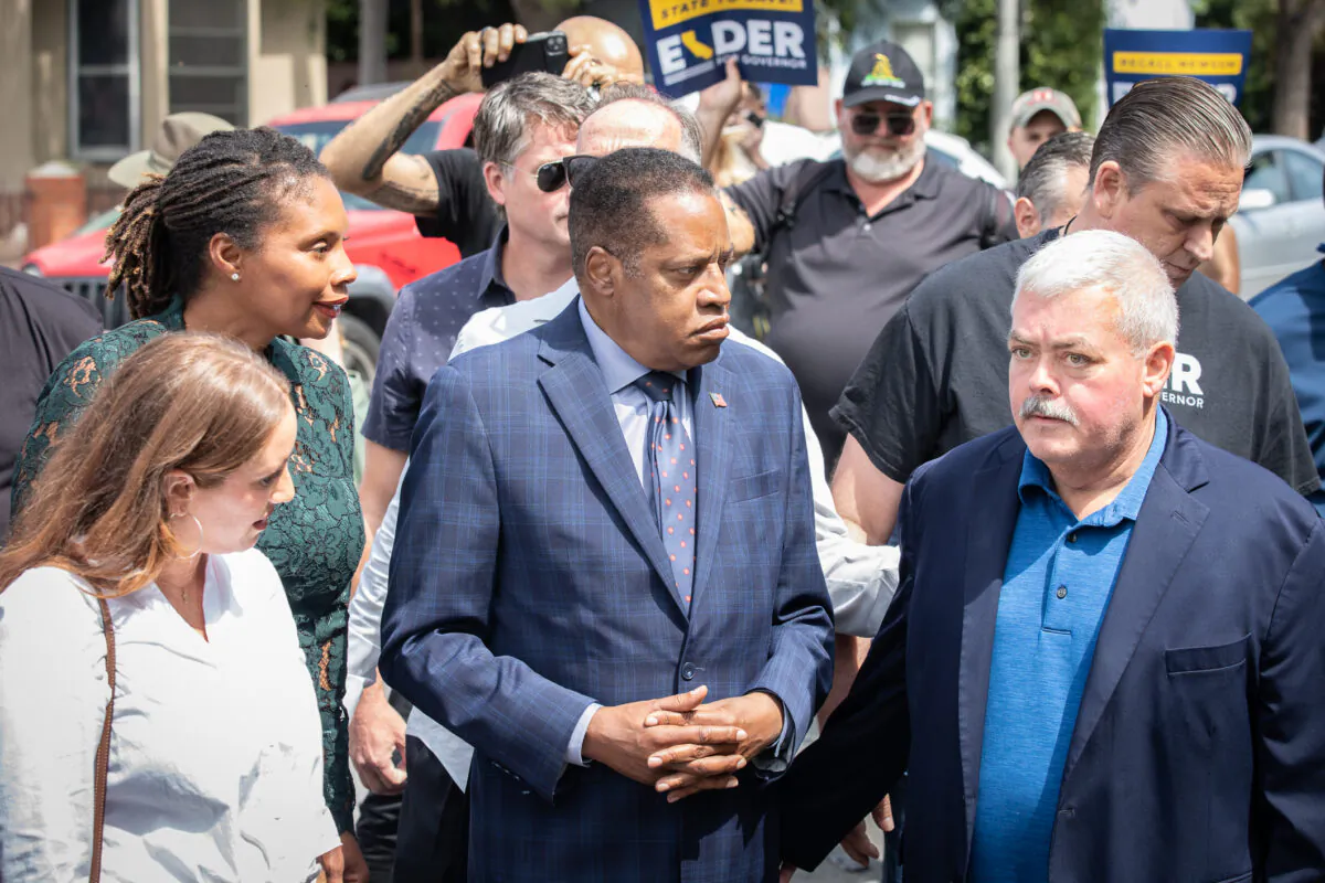 Larry Elder walks with staff and residents of Venice Beach, Calif., through streets with high populations of homeless individuals on Sept. 8, 2021. (John Fredricks/The Epoch Times)