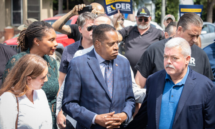 Larry Elder walks with staff and residents of Venice Beach, Calif., through streets with high populations of homeless individuals on Sept. 8, 2021. (John Fredricks/The Epoch Times)