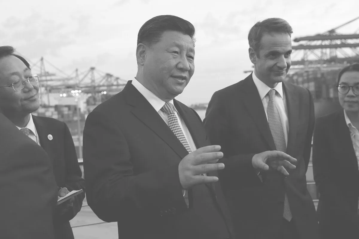 Chinese leader Xi Jinping (L) and Greek Prime Minister Kyriakos Mitsotakis visit the cargo terminal of Chinese company Cosco in the Port of Piraeus, Greece, on Nov. 11, 2019. (Orestis Panagiotou/AFP via Getty Images)