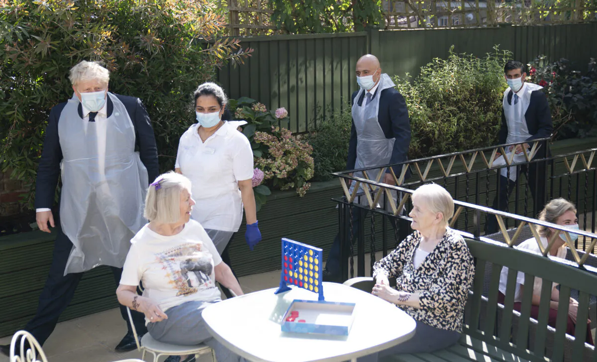 Politicians, led by Prime Minister Boris Johnson, visit residents in the Westport Care Home for the elderly in Stepney Green, in London, England, on Sept. 7, 2021. (Paul Edwards/WPA Pool/Getty Images)