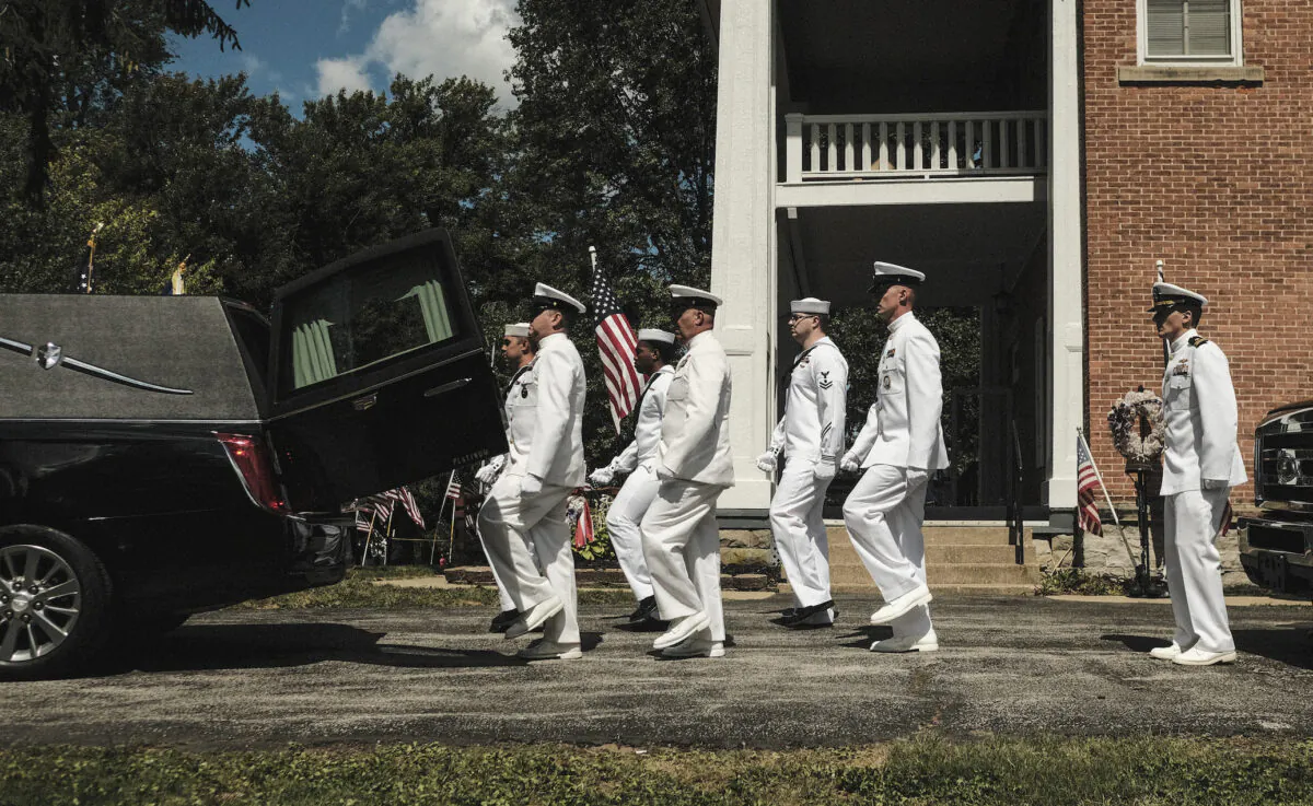 Members of the U.S. Navy prepare to carry the remains of U.S. Navy Corpsman Max Soviak at the Morman Hinman Tanner Funeral Home in his hometown of Berlin Heights, Ohio, on Sept. 8, 2021. (Matthew Hatcher/Getty Images)
