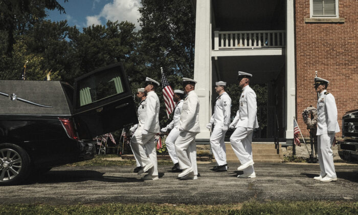 Members of the U.S. Navy prepare to carry the remains of U.S. Navy Corpsman Max Soviak at the Morman Hinman Tanner Funeral Home in his hometown Berlin Heights, Ohio, on Sept. 8, 2021 in Berlin Heights, Ohio. (Matthew Hatcher/Getty Images)