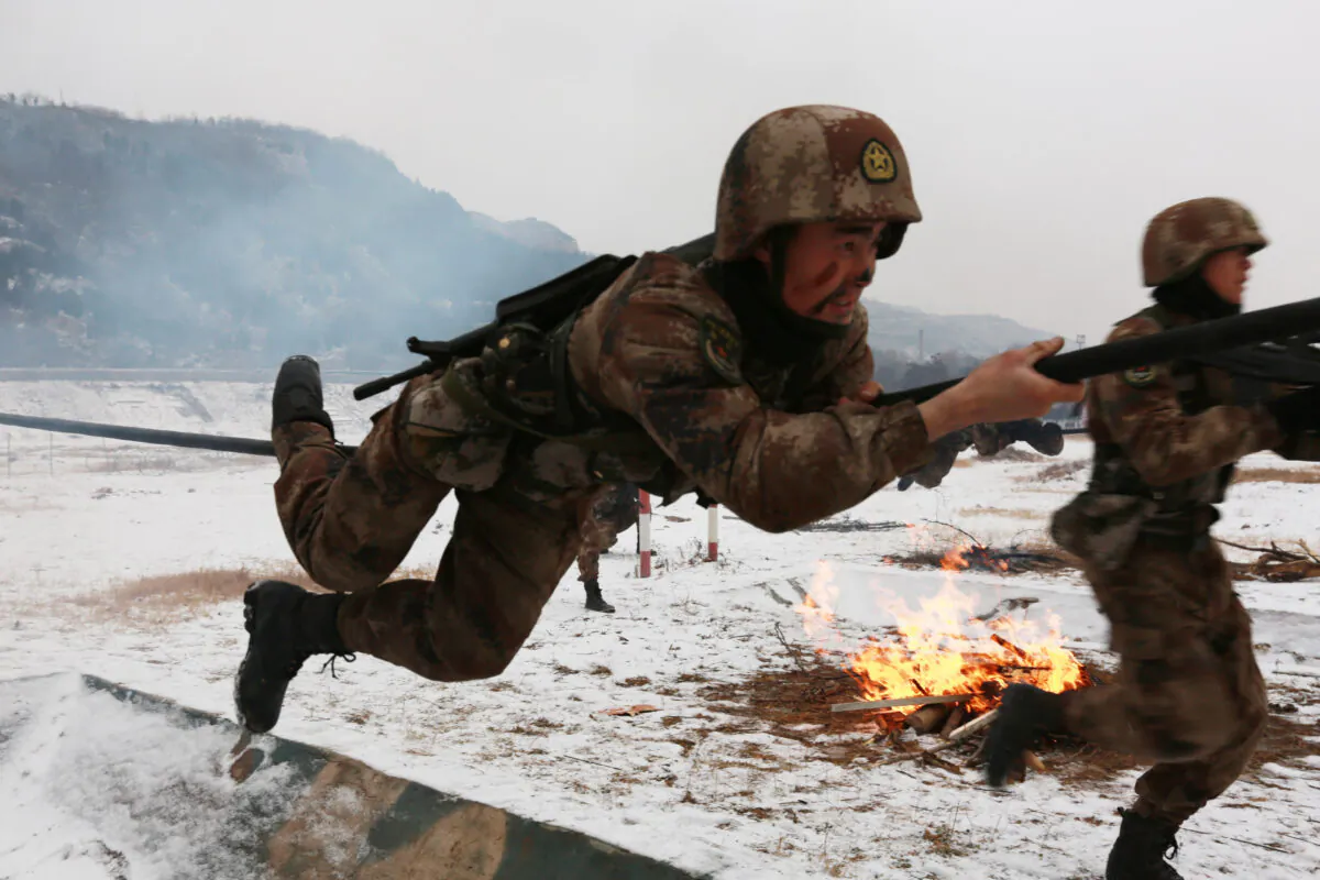 Soldiers of The People's Liberation Army (PLA) take part in military exercises after a snowfall on Jan. 24, 2018 in Tianshui, Gansu Province of China.  (Getty Images)