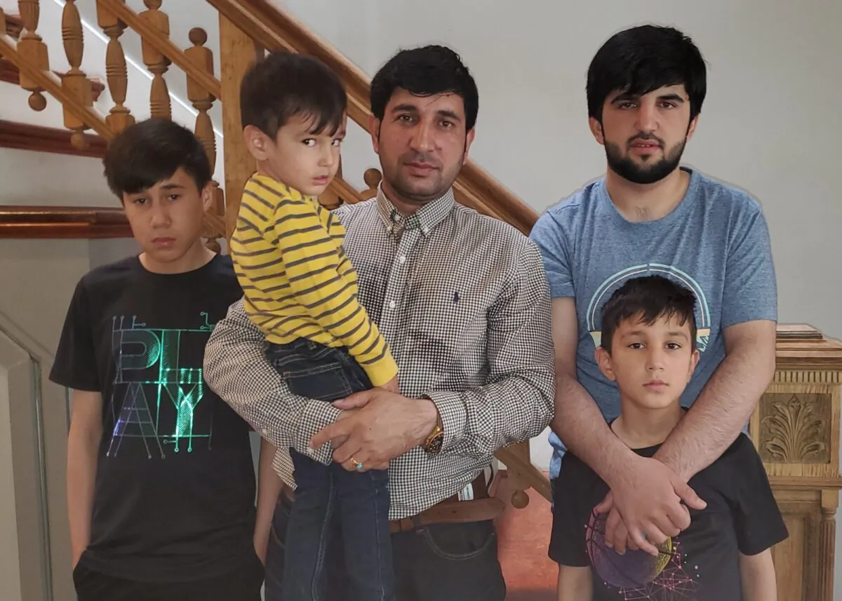 Mohammad Khalid Wardak and his children are seen on Sept. 7, 2021. (AP Photo).