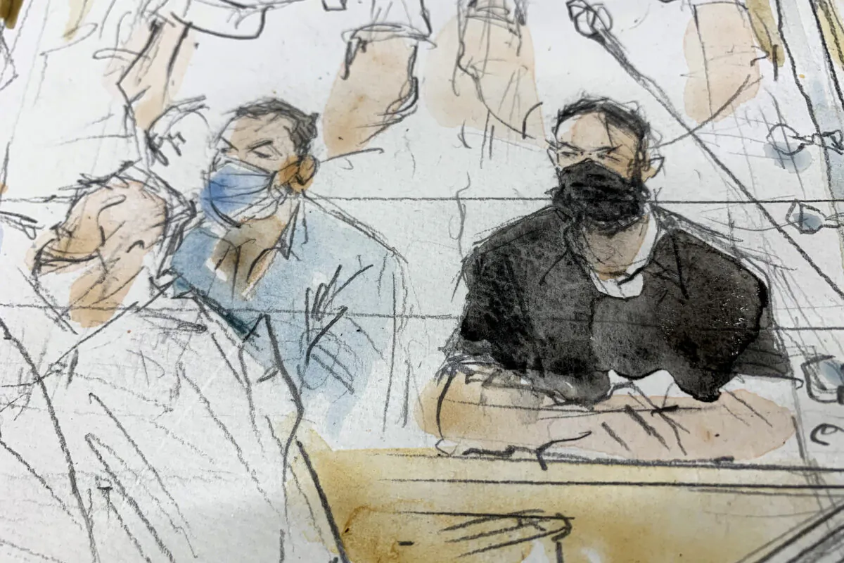 This sketch shows key defendant Salah Abdeslam, right, in the special courtroom built for the 2015 attacks trial in Paris, France, on Sept. 8, 2021. (Noelle Herrenschmidt/AP Photo)