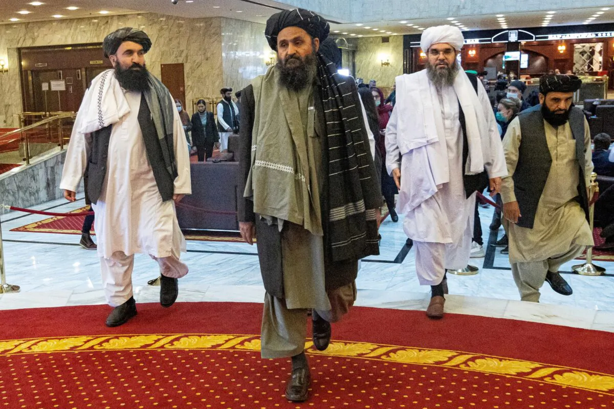 Mullah Abdul Ghani Baradar, the Taliban's deputy leader and negotiator, and other delegation members attend the Afghan peace conference in Moscow on March 18, 2021. (Alexander Zemlianichenko/Pool via Reuters)