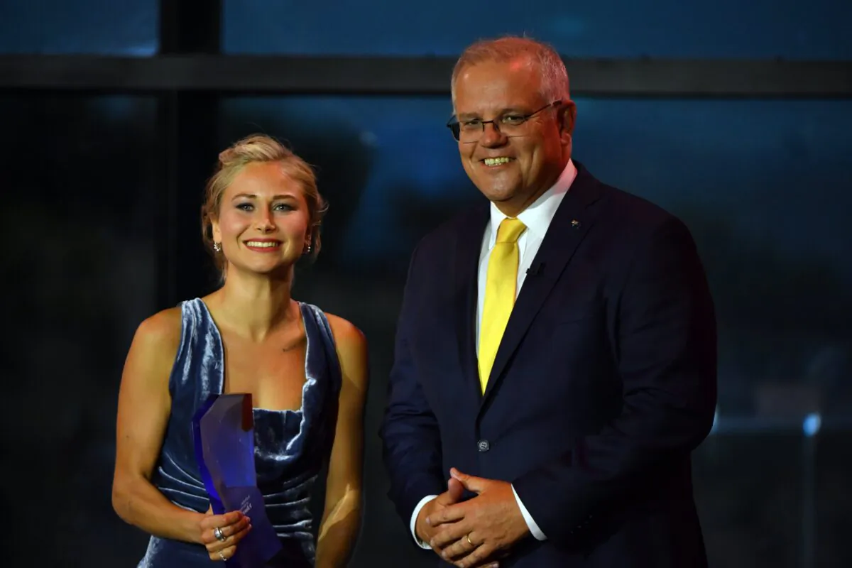 Prime Minister Scott Morrison and 2021 Australian of the Year winner Grace Tame at the National Arboretum in Canberra, Australia, on Jan. 25, 2021. (AAP Image/Mick Tsikas)