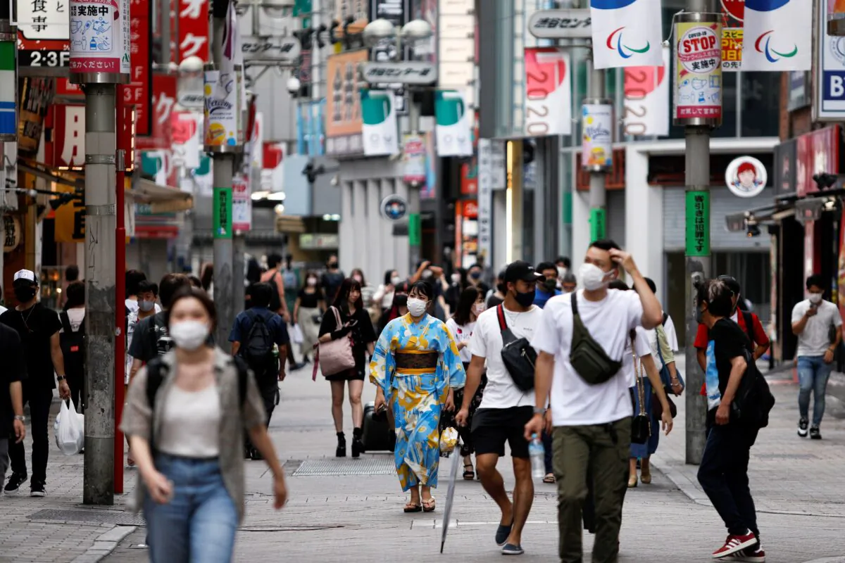 People walk in Shibuya shopping area, during a state of emergency amid the coronavirus disease (COVID-19) outbreak in Tokyo, Japan Aug. 29, 2021. (Androniki Christodoulou/Reuters)