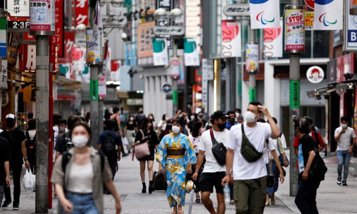 People walk in Shibuya shopping area, during a state of emergency amid the coronavirus disease (COVID-19) outbreak in Tokyo, Japan Aug. 29, 2021. (Androniki Christodoulou/Reuters)