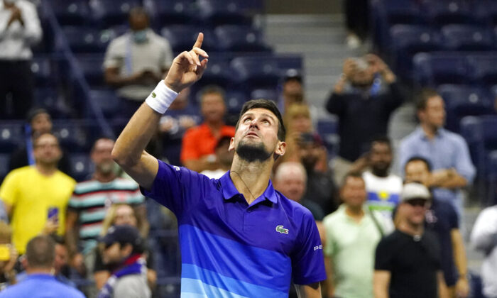 Novak Djokovic of Serbia motions and looks up after defeating Matteo Berrettini of Italy during the quarterfinals of the U.S. Open tennis tournament in New York, on Sept. 9, 2021. (Frank Franklin II/AP Photo)
