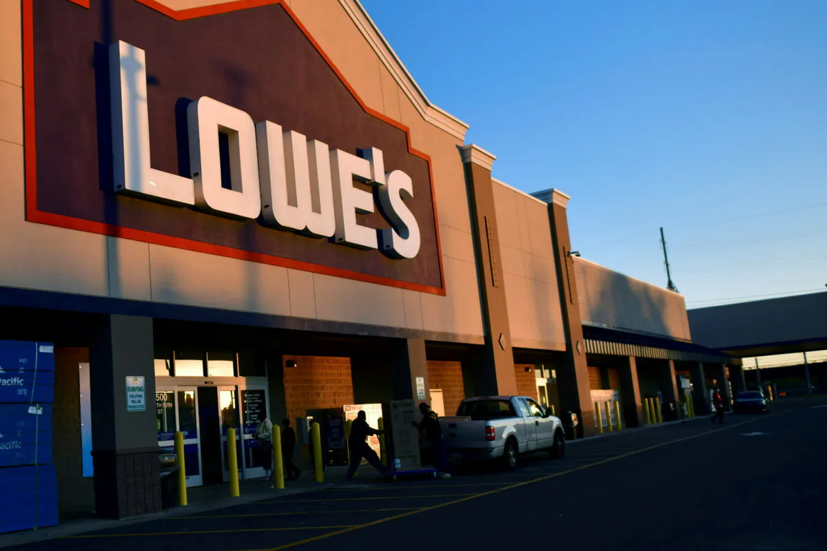 Shoppers load a box of merchandise into a truck after visiting a Lowe's hardware store in Philadelphia, Pa., on Nov. 4, 2020. (Mark Makela/Reuters)