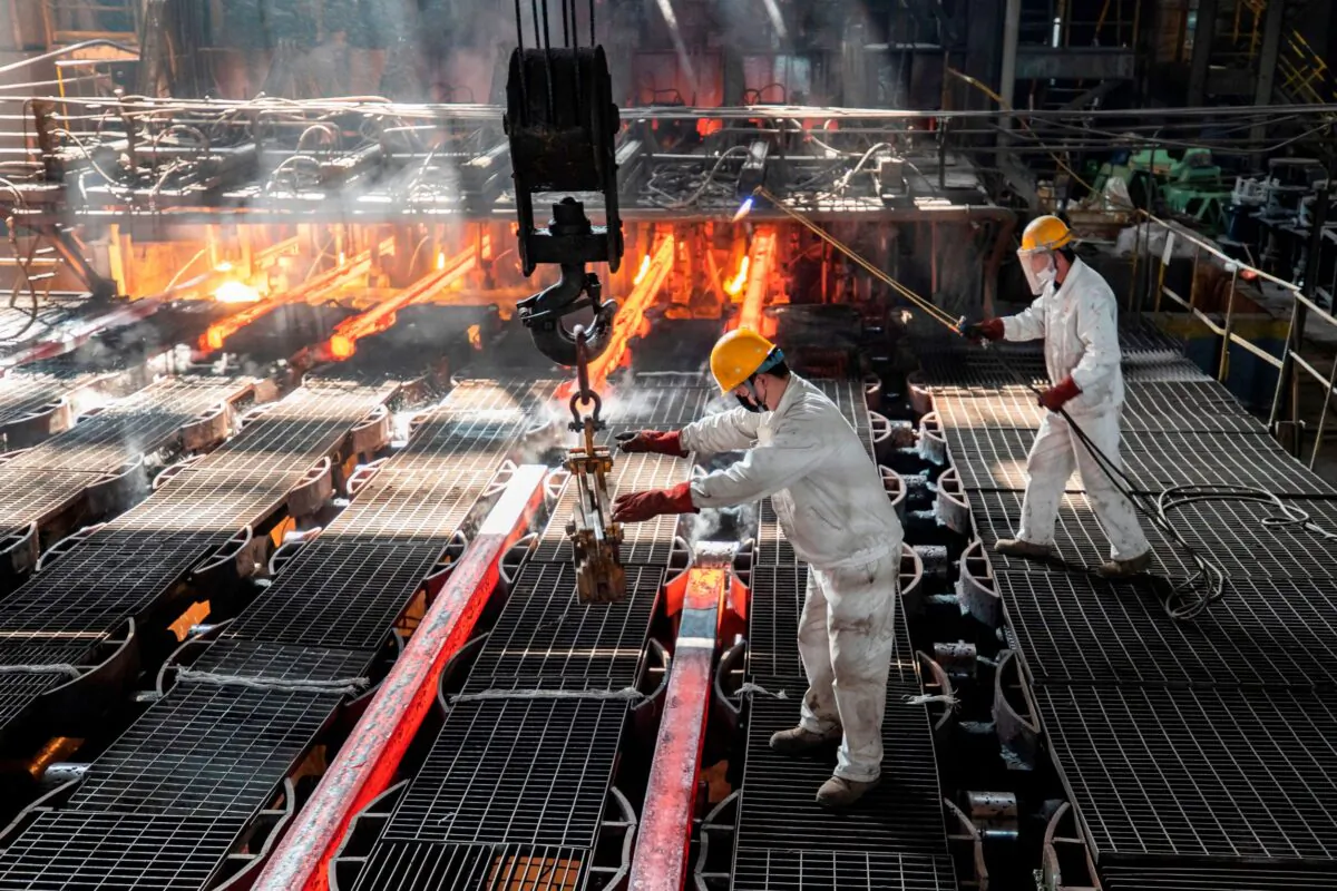 Workers make iron bars in a steel factory in Lianyungang, in China's eastern Jiangsu Province, on Feb. 12, 2021. (AFP via Getty Images)