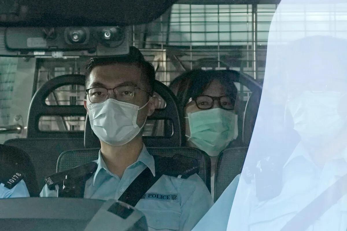 Chow Han Tung, vice chairwoman of the Hong Kong Alliance in Support of Patriotic Democratic Movements of China (C) is escorted by police in a van to a court, in Hong Kong, on Sept. 10, 2021. (Kin Cheung/AP Photo)
