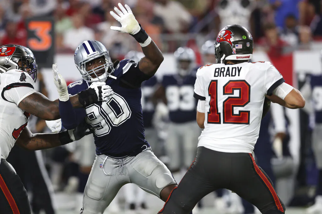 Dallas Cowboys defensive end DeMarcus Lawrence (90) pressures Tampa Bay Buccaneers quarterback Tom Brady (12) during the second half of an NFL football game in Tampa, Fla., on Sept. 9, 2021. (Mark LoMoglio/AP Photo)
