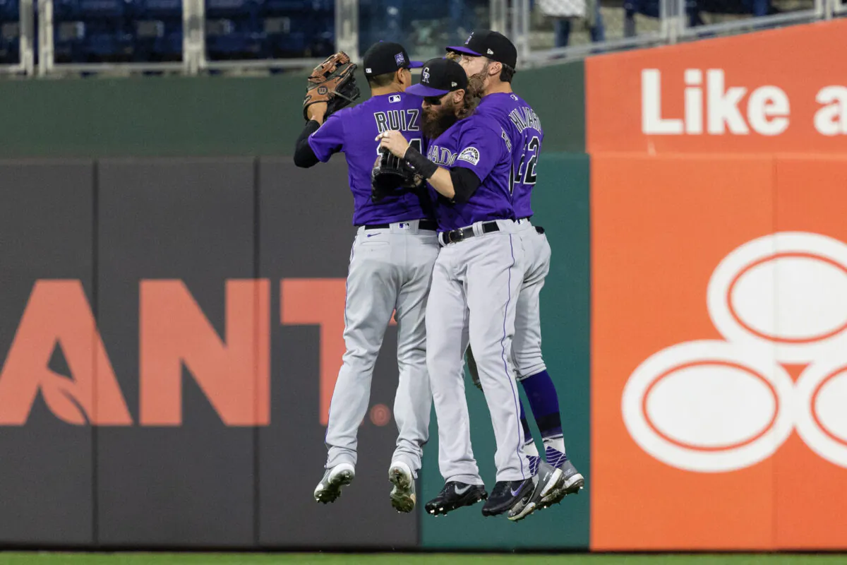 Colorado Rockies second baseman Rio Ruiz (14) and right fielder Charlie Blackmon (19) and right fielder Sam Hilliard (22) celebrate after defeating the Philadelphia Phillies at Citizens Bank Park in Philadelphia, Pa., on Sept. 9, 2021. (Bill Streicher/USA TODAY Sports via Reuters)