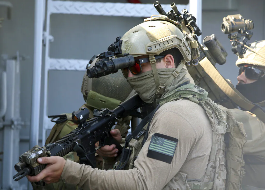 A U.S. Navy SEAL special forces operator, front, and colleagues during a joint U.S.-Cyprus military drill at Limassol port on Sept. 10, 2021. (Philippos Christou/AP Photo)