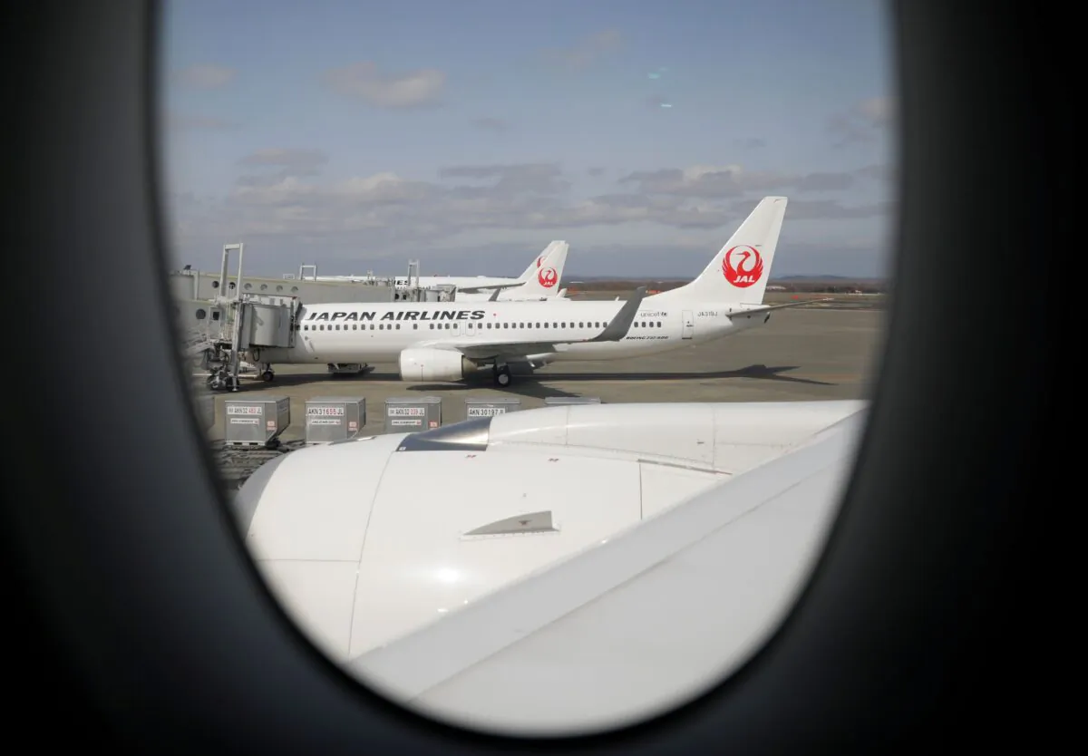 Japan Airlines (JAL) planes sit on the tarmac at New Chitose Airport, in Sapporo, Hokkaido, Japan on May 4, 2021. (Issei Kato/Reuters)