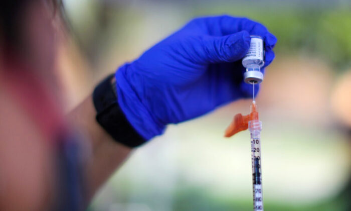 A nurse prepares a Pfizer BioNTech COVID-19 vaccination in Los Angeles, Calif., on Aug. 23, 2021. (Lucy Nicholson/Reuters)