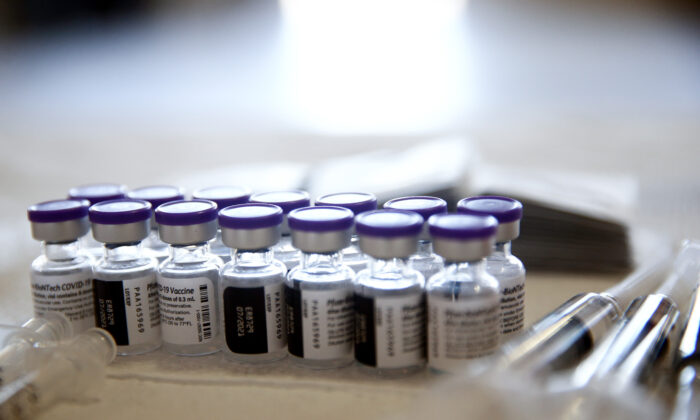 Vials containing doses of the Pfizer COVID-19 vaccine are viewed at a clinic in Los Angeles, Calif., on April 9, 2021. (Mario Tama/Getty Images)