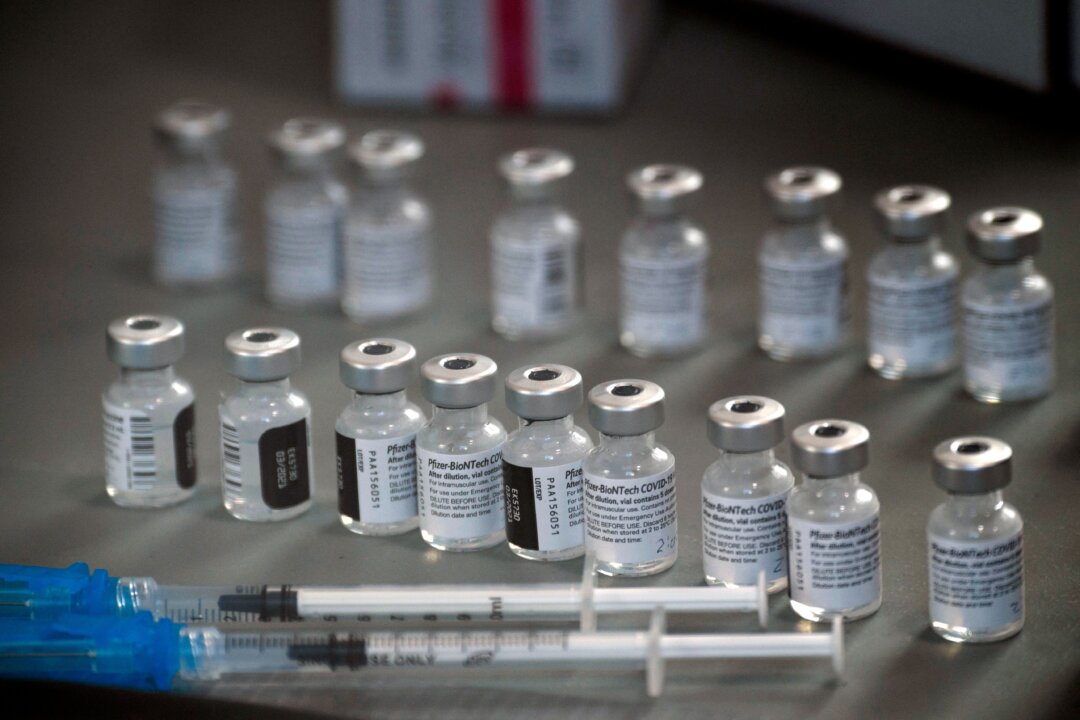Syringes and vials of the Pfizer-BioNTech COVID-19 vaccine are prepared to be administered to front-line health care workers under an emergency use authorization at a drive up vaccination site from Renown Health in Reno, Nev. on Dec. 17, 2020. (Patrick T. Fallon/AFP via Getty Images)