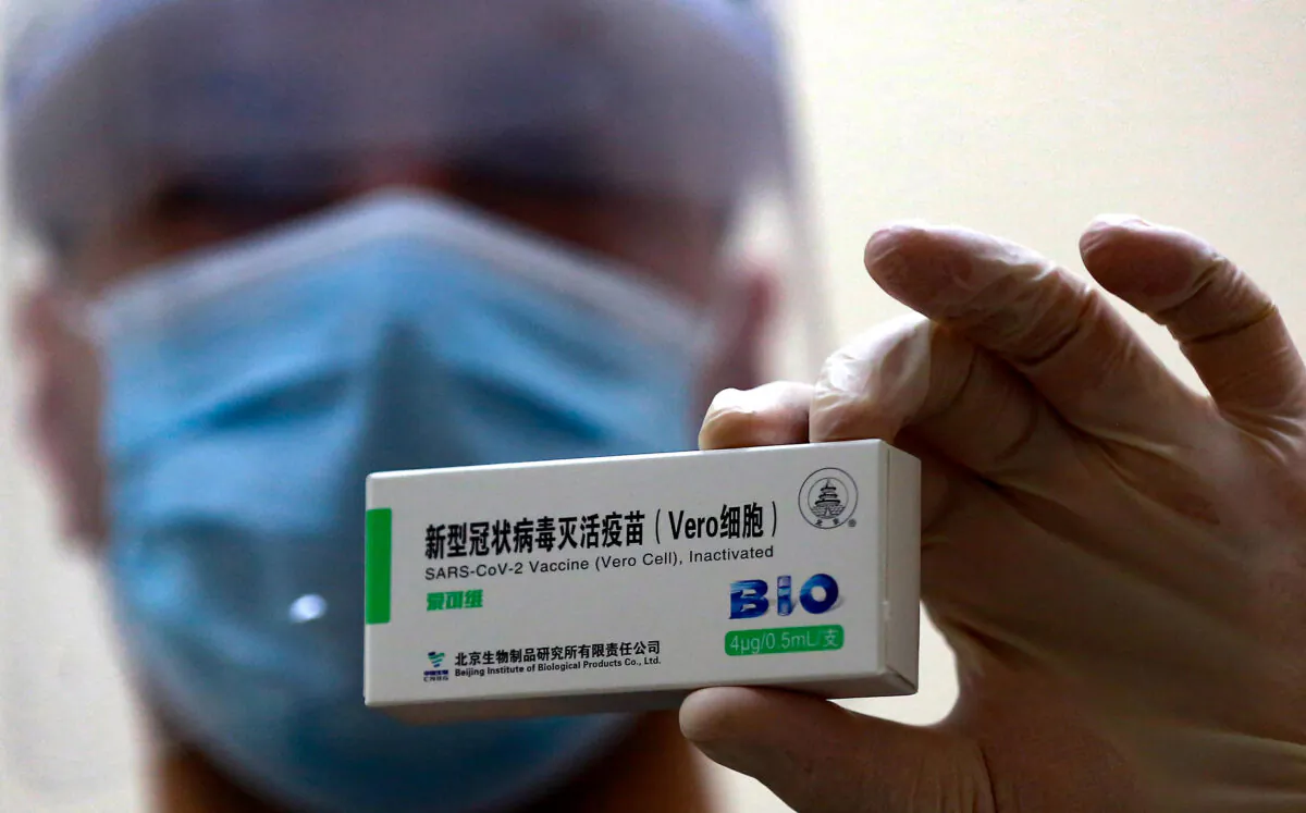 A health worker shows a dose of the Chinese Sinopharm vaccine for COVID-19 disease, at a vaccination centre in the Jordanian capital Amman, on January 13, 2021.  (KHALIL MAZRAAWI/AFP via Getty Images)