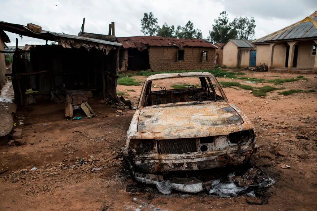 A burnt out vehicle is seen in the Nghar Village, near Jos on June 27, 2018. Fulani herdsmen attacked the village.   STEFAN HEUNIS/AFP via Getty Images)