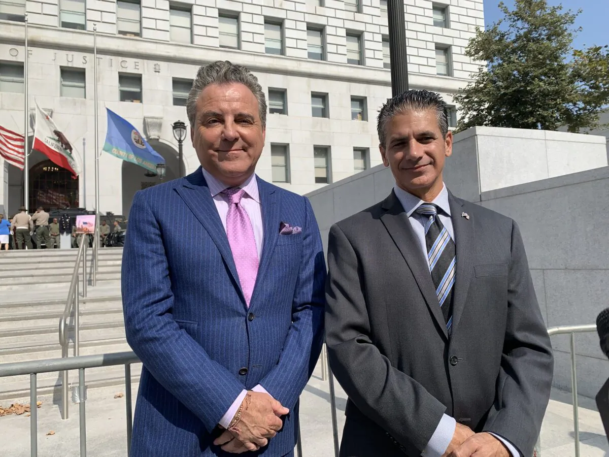Los Angeles County Deputy District Attorney Jon Hatami (R) and attorney Brian Claypool (L) held a press release in front of the Hall of Justice in downtown Los Angeles 
on Sept. 8, 2021. (Linda Jiang/The Epoch Times)