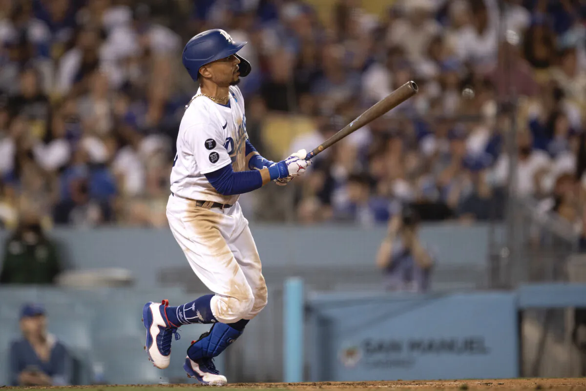 Los Angeles Dodgers' Mookie Betts watches his three-run home run during the fifth inning of the team's baseball game against the San Diego Padres in Los Angeles on Sept. 11, 2021. (AP Photo/Kyusung Gong)