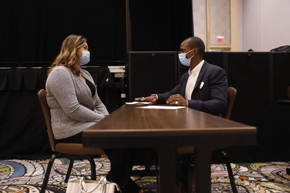 A Seminole Hard Rock Casino department manager (R) conducts an interview with a potential employee during a job fair at the Seminole Hard Rock Casino in Tampa, Fla., on May 25, 2021. (Octavio Jones/Getty Images)