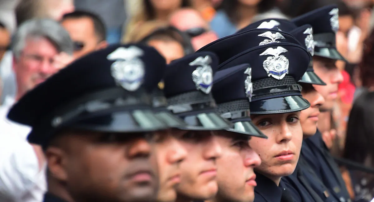 Police recruits attend their graduation ceremony at LAPD Headquarters in Los Angeles on July 8, 2016. (Frederic Brown/AFP via Getty Images)