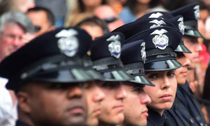 Police recruits attend their graduation ceremony at LAPD Headquarters in Los Angeles on July 8, 2016. (Frederic J. Brown/AFP via Getty Images)