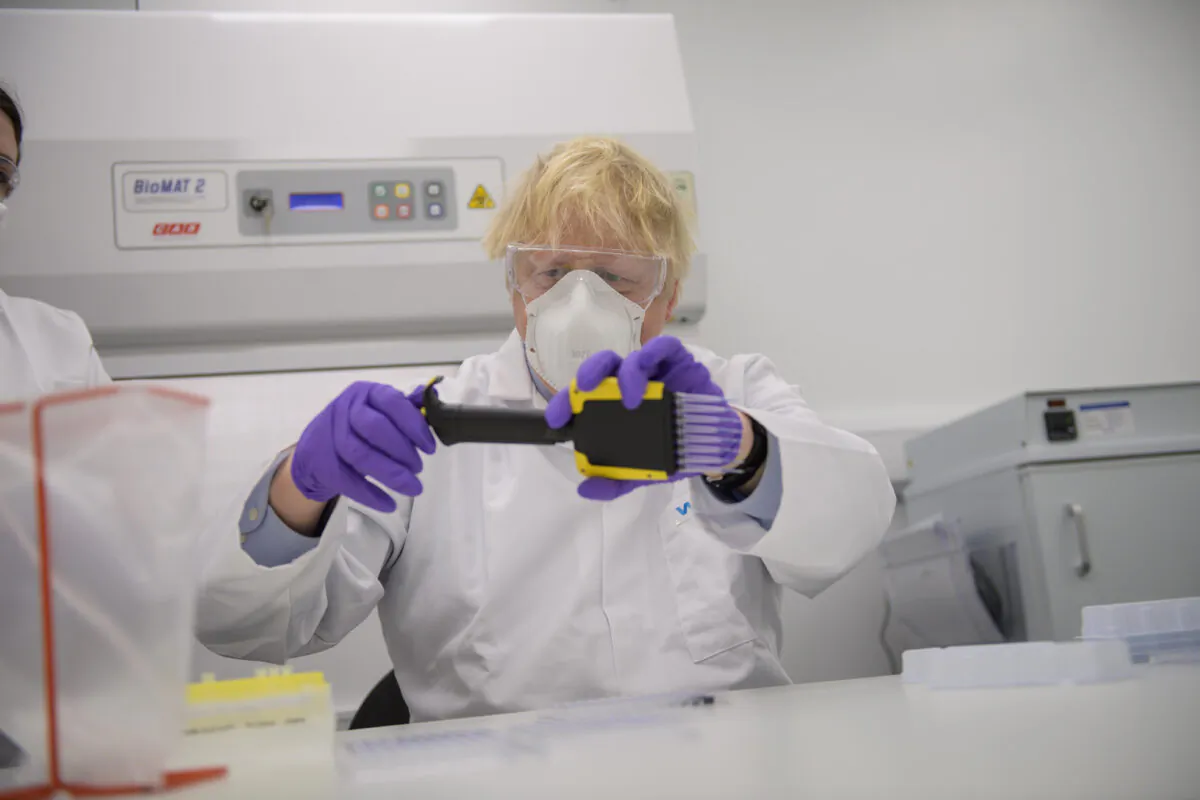 Prime Minister Boris Johnson during a visit to a laboratory at Valneva in Livingston where they will be producing a COVID-19 vaccine on a large scale, in Scotland on Jan. 28, 2021. (Wattie Cheung/Daily Mail via PA)