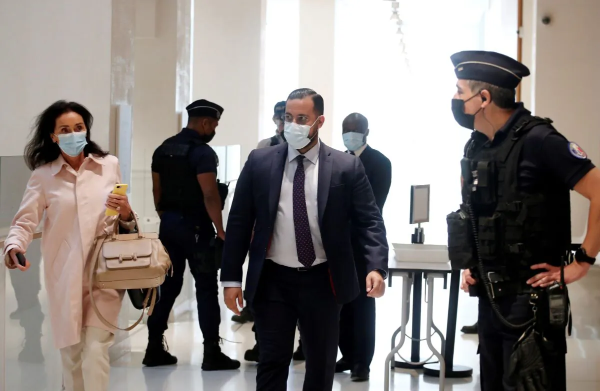 Alexandre Benalla, a former security advisor of French President Emmanuel Macron, arrives with his lawyer Jacqueline Laffont on the first day of his trial for violence committed against demonstrators at a May Day protest in 2018, at the courthouse in Paris, France, on Sept. 13, 2021. (Benoit Tessier/Reuters)