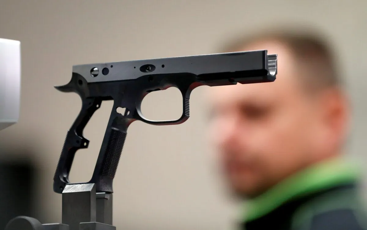 An employee works in the Ceska Zbrojovka small arms factory in Uhersky Brod, Czech Republic, on Aug. 31, 2021. (David W Cerny/Reuters)