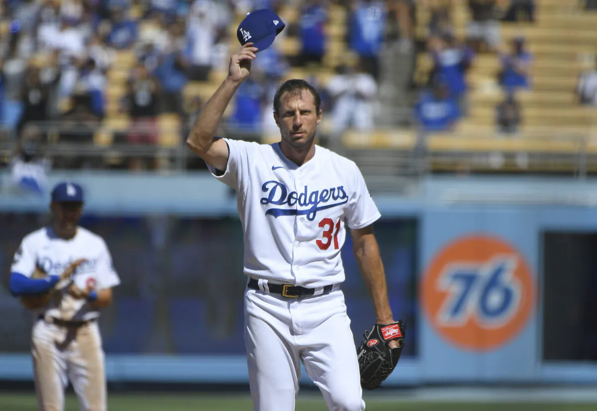 Los Angeles Dodgers Max Scherzer tips his cap after he pitched his 3000th career strikeout against San Diego Padres first baseman Eric Hosmer in the fifth inning during in a baseball game in Los Angeles on Sept. 12, 2021. (AP Photo/John McCoy)