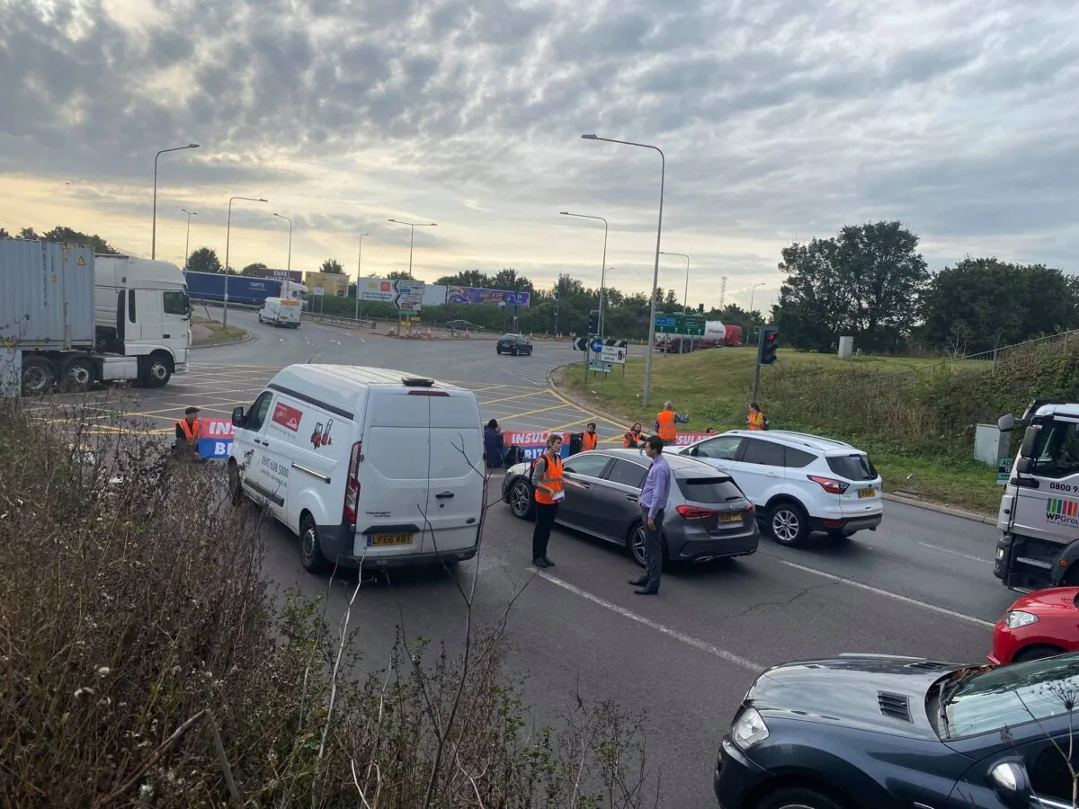 Protesters block traffic at an unspecified M25 junction in Greater London on Sept. 13, 2021. (Katie Day/PA)