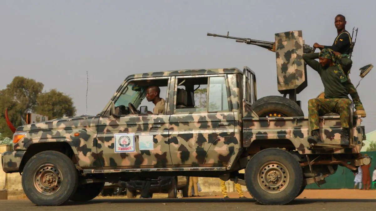 Security forces patrol as people wait for the arrival of the rescued schoolgirls in Jangebe, Zamfara, Nigeria, on March 3, 2021. (Afolabi Sotunde/File Photo/Reuters)