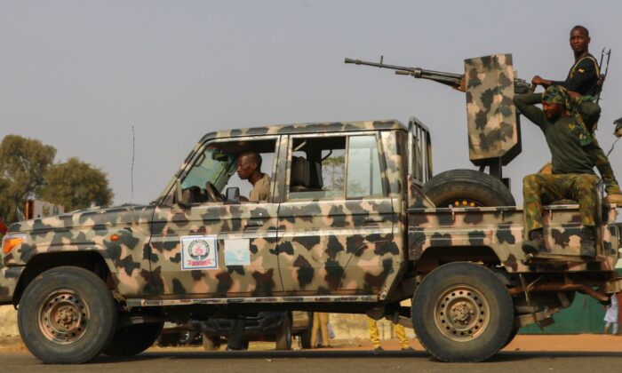 Security forces patrol as people wait for the arrival of the rescued  schoolgirls in Jangebe, Zamfara, Nigeria, on March 3, 2021. (Afolabi Sotunde/File Photo/Reuters)
