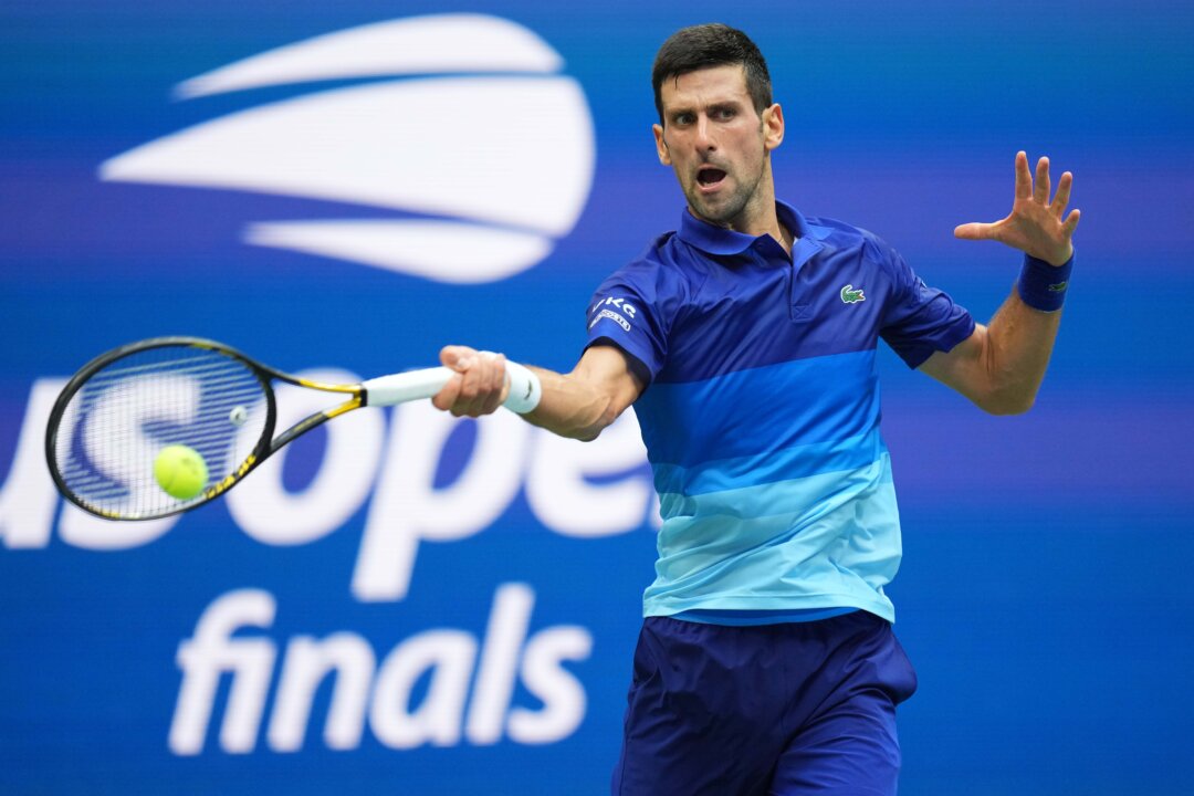 Novak Djokovic of Serbia hits a forehand against Daniil Medvedev of Russia (not pictured) in the men's singles final on day fourteen of the 2021 U.S. Open tennis tournament at USTA Billie Jean King National Tennis Center in Flushing, New York, on Sept. 12, 2021. (Danielle Parhizkaran/USA TODAY Sports via Reuters)