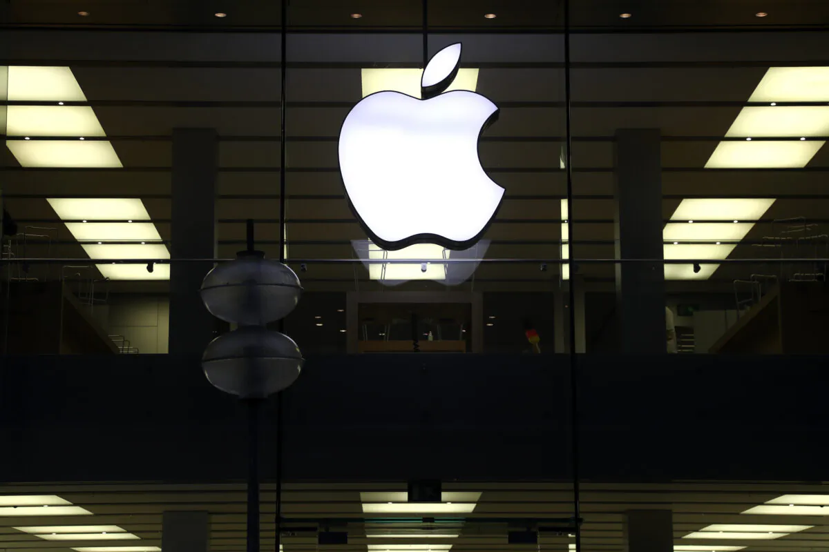 An illuminated Apple logo at a store in Munich, Germany, on Dec. 16, 2020. (Matthias Schrader/AP Photo)
