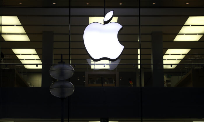 An illuminated Apple logo at a store in Munich, Germany, on Dec. 16, 2020. (Matthias Schrader/AP Photo)