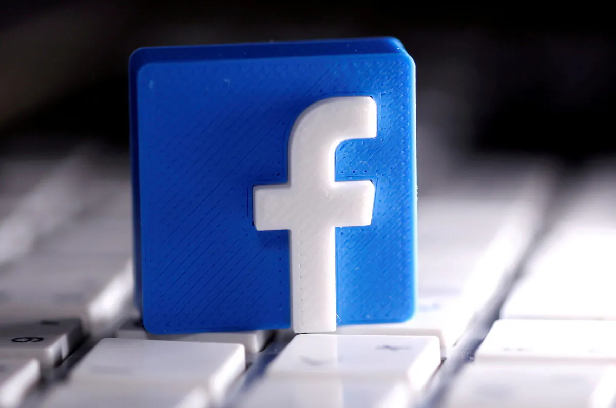 A 3D-printed Facebook logo is seen placed on a keyboard in this illustration taken on March 25, 2020. (Dado Ruvic/Illustration/Reuters)