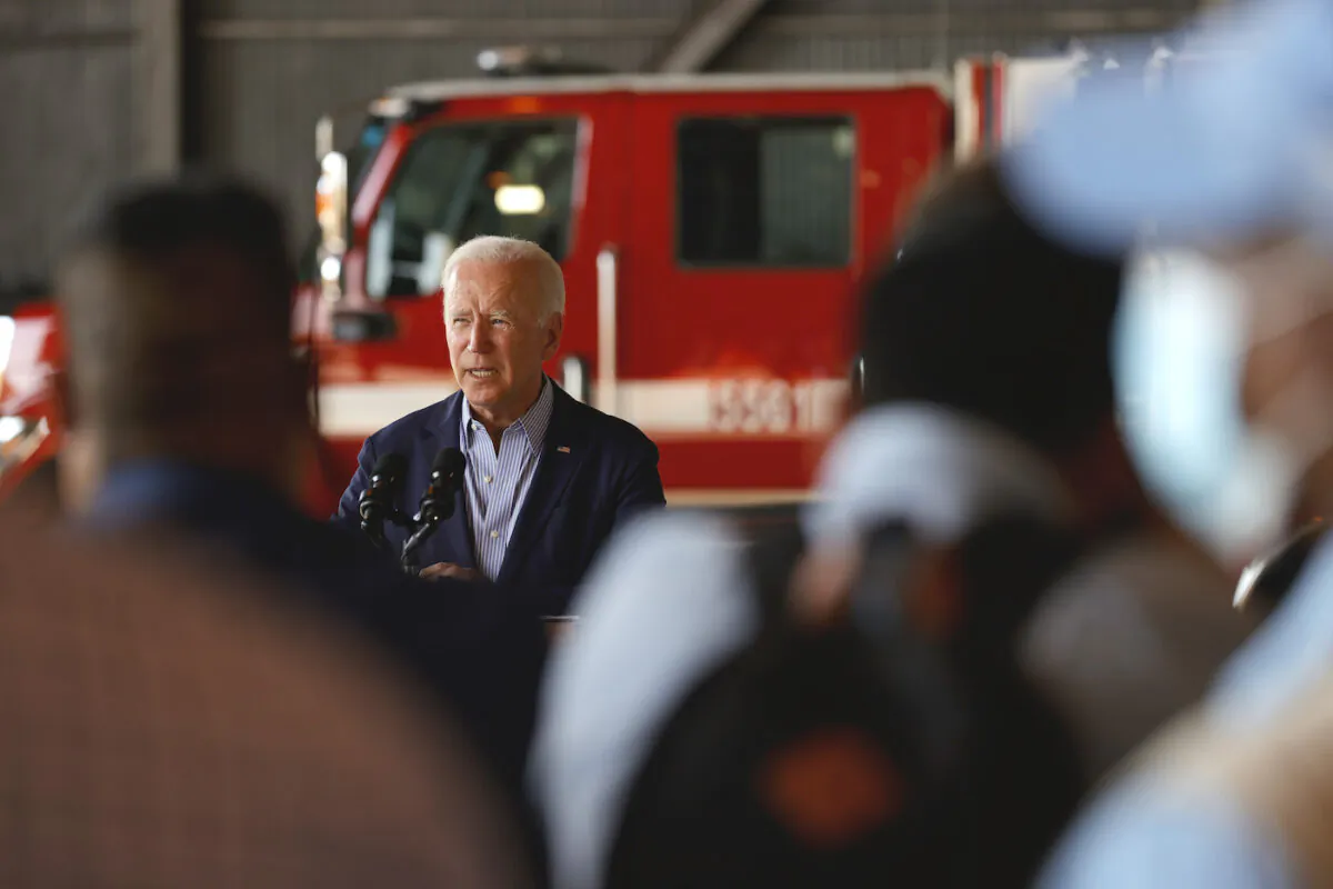 U.S. President Joe Biden delivers remarks to reporters after doing a helicopter tour with California Gov. Gavin Newsom of the Caldor fire, at Mather Airport on Sept. 13, 2021. (Justin Sullivan/Getty Images)