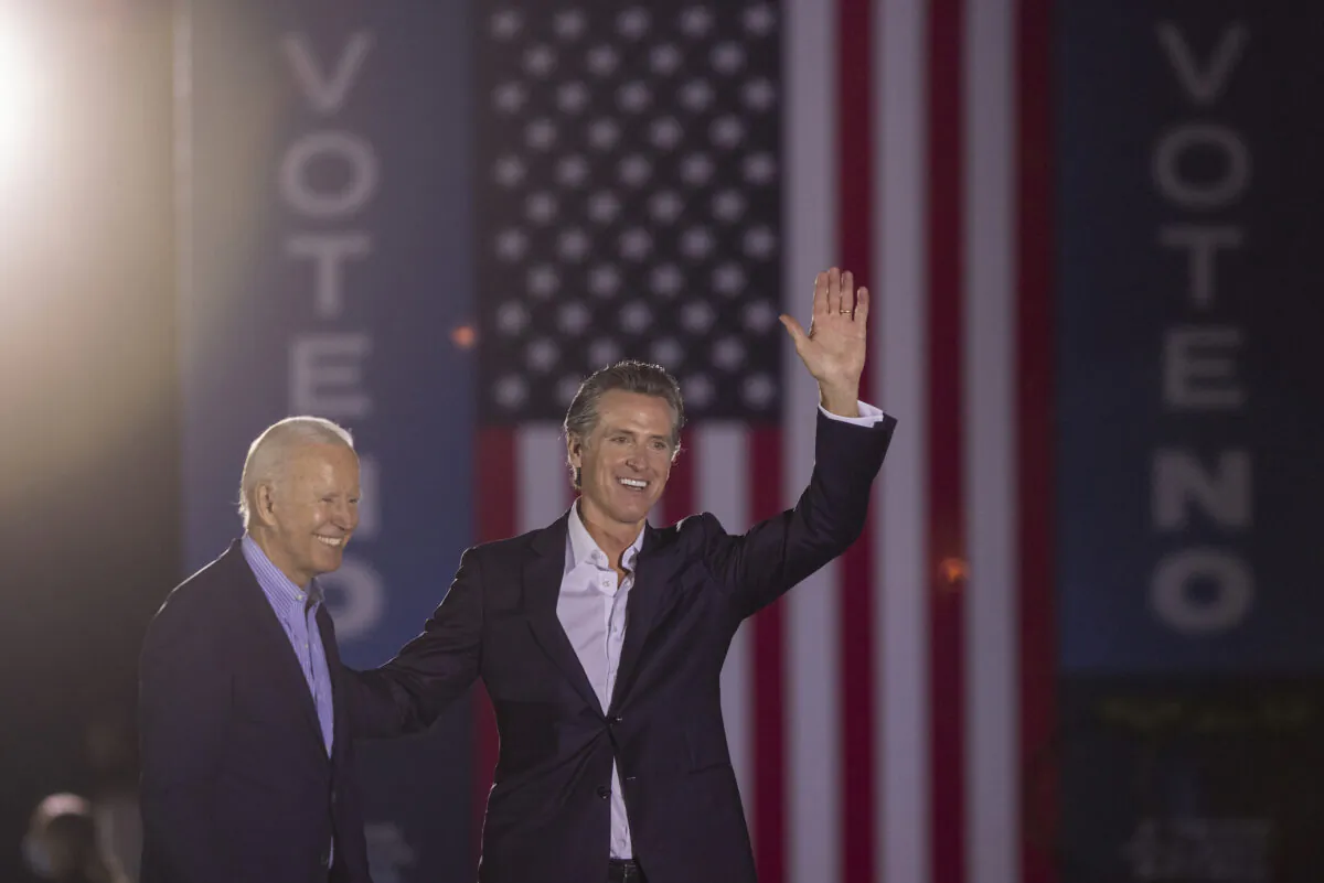 President Joe Biden and California Gov. Gavin Newsom wave to the crowd at Long Beach City College in Long Beach, Calif., on Sept. 13, 2021. (David McNew/Getty Images)